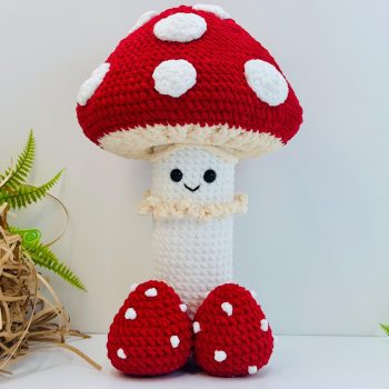 Hand lifting removable cap off crochet mushroom revealing naughty surprise inside